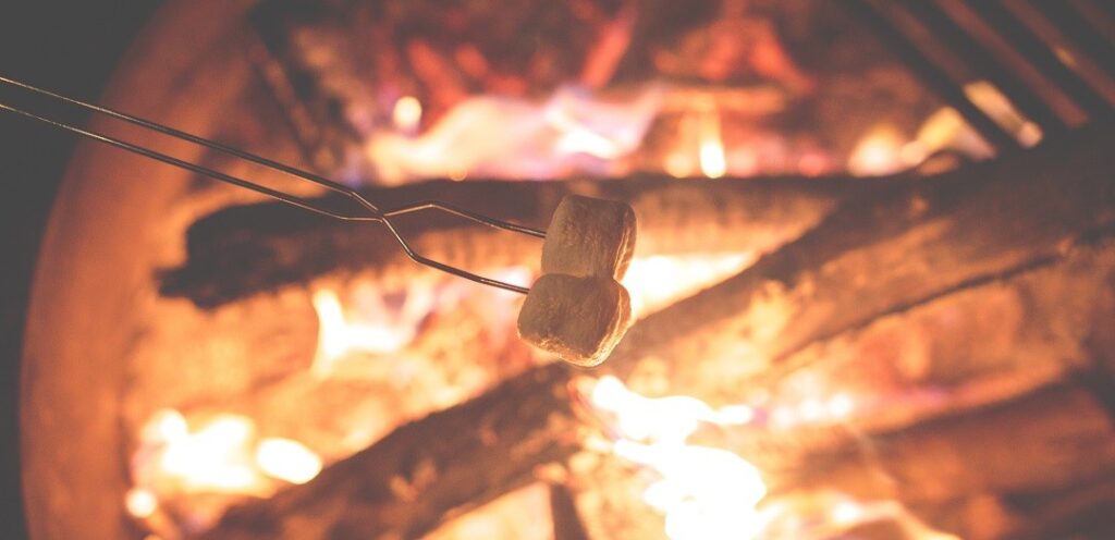 Marshmallows roasting over fire for making s'mores (UK method)